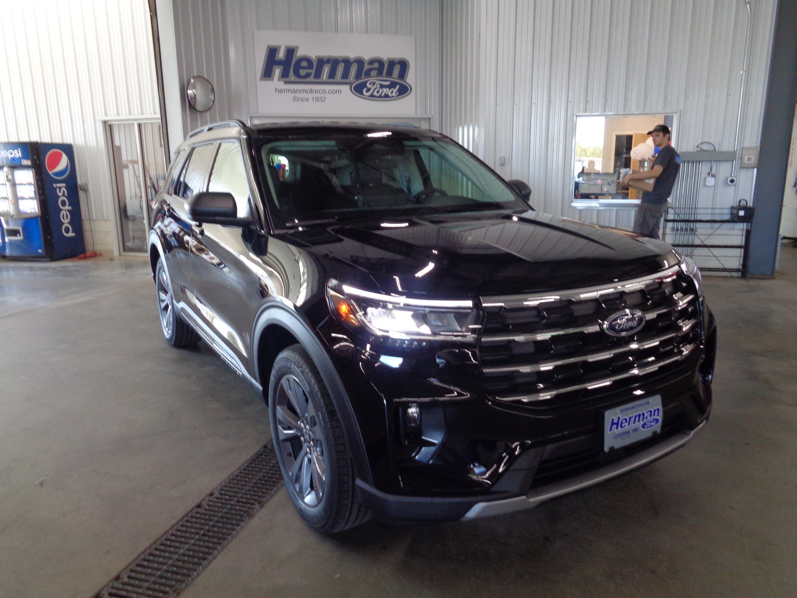2026 Ford Explorer Active in Agate Black Metallic — front three-quarter view