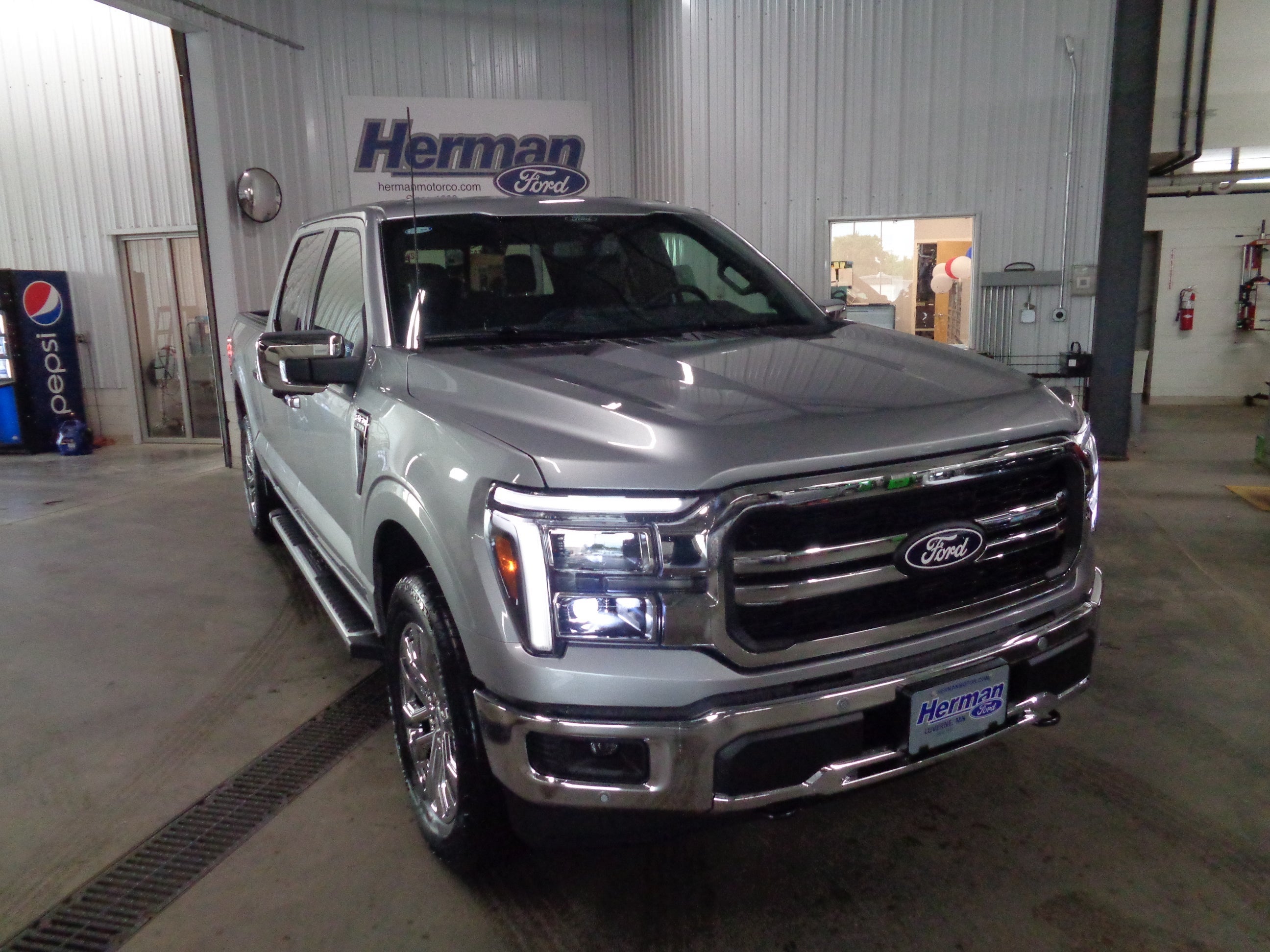 2026 Ford F-150 Lariat in Iconic Silver Metallic — front three-quarter view