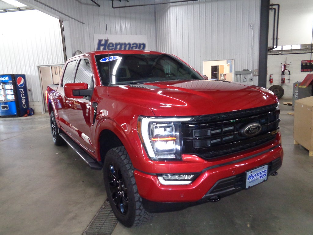 2023 Ford F-150 Lariat in Red — front three-quarter view